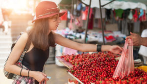 Woman Buying Cherries