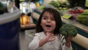 Child Holding Broccoli