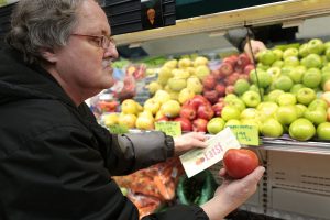 Man Holding Tomato and EatSF Voucher