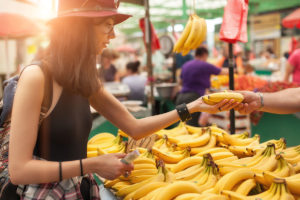 Woman Buying Bananas