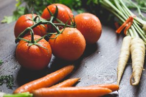 Fresh vegetables: tomatoes and carrots