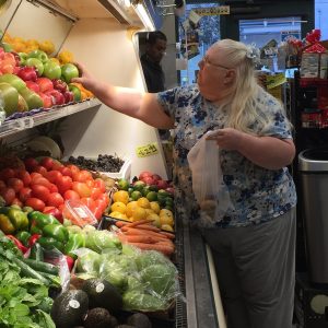Woman selecting produce